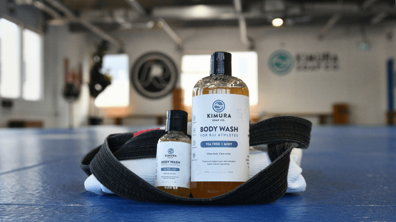 Why use tea tree oil for BJJ soap shown with a gi and gym bag