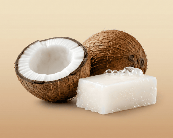 Coconut and a bar of soap on a beige background